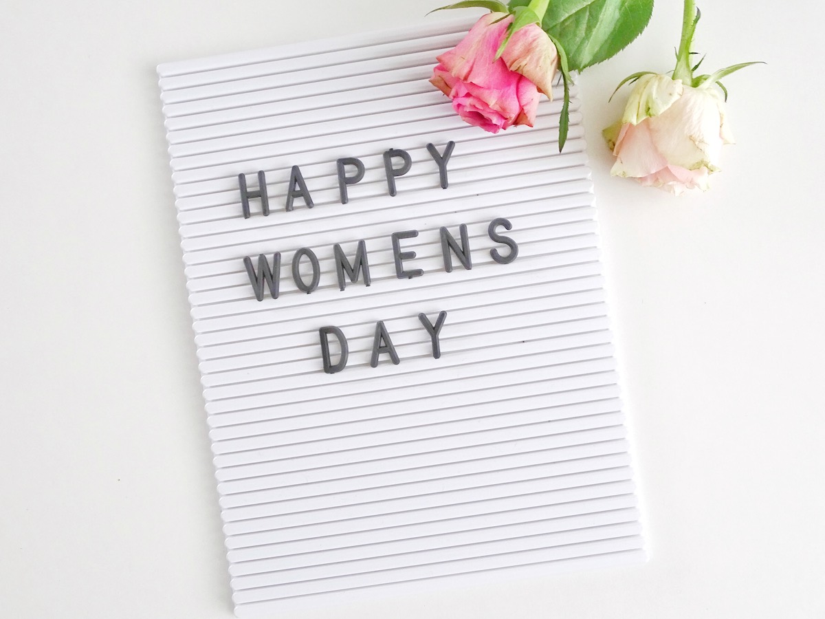 a plaque reads "Happy Women's Day"
