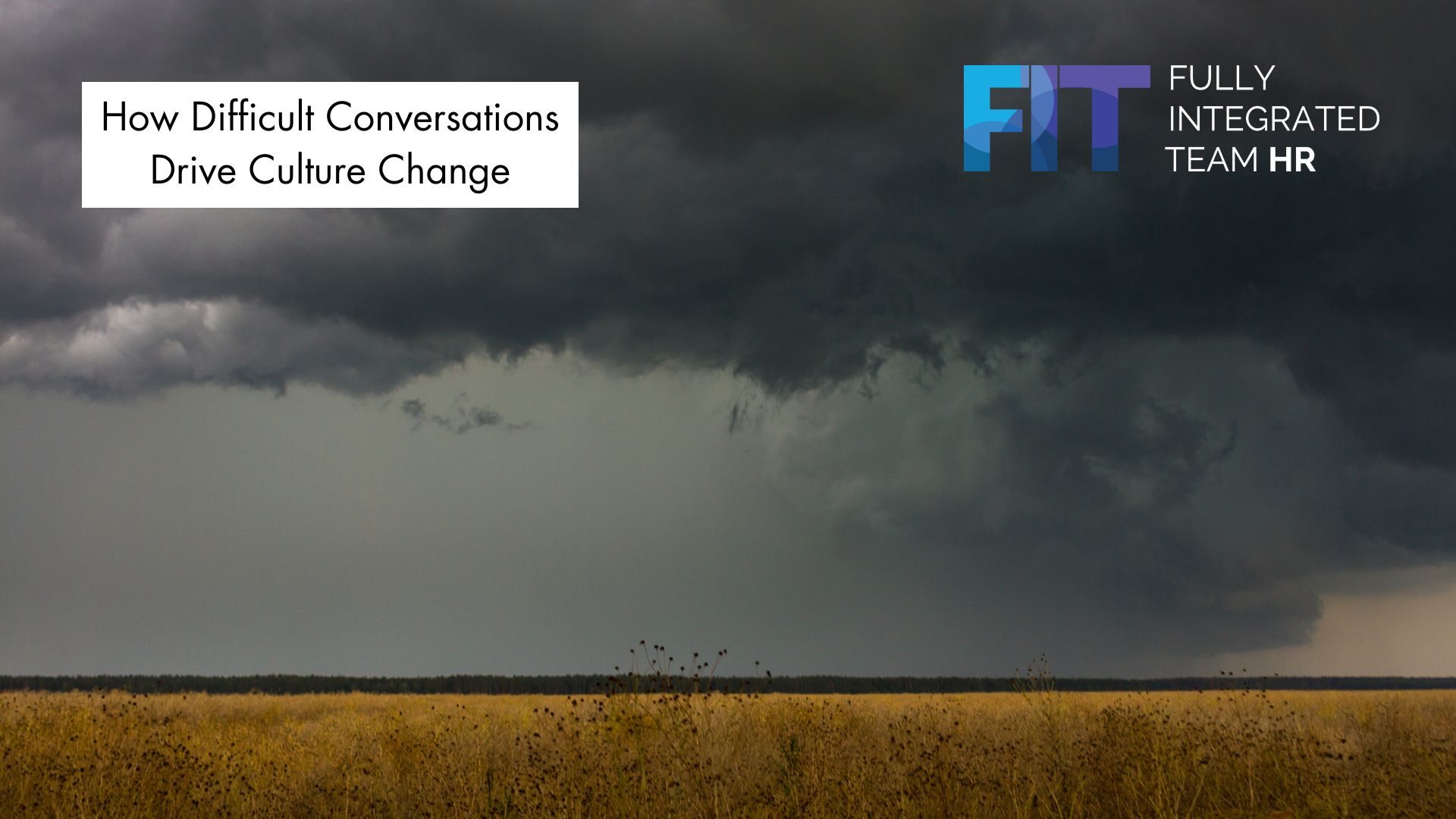 Dark storm clouds rolling over a field, symbolizing the challenge of difficult workplace conversations and the opportunity for cultural change.